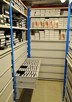 Steel storage drawers within shelving units