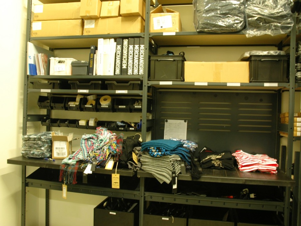 Bespoke stockroom shelving setup as a workstation finished in black