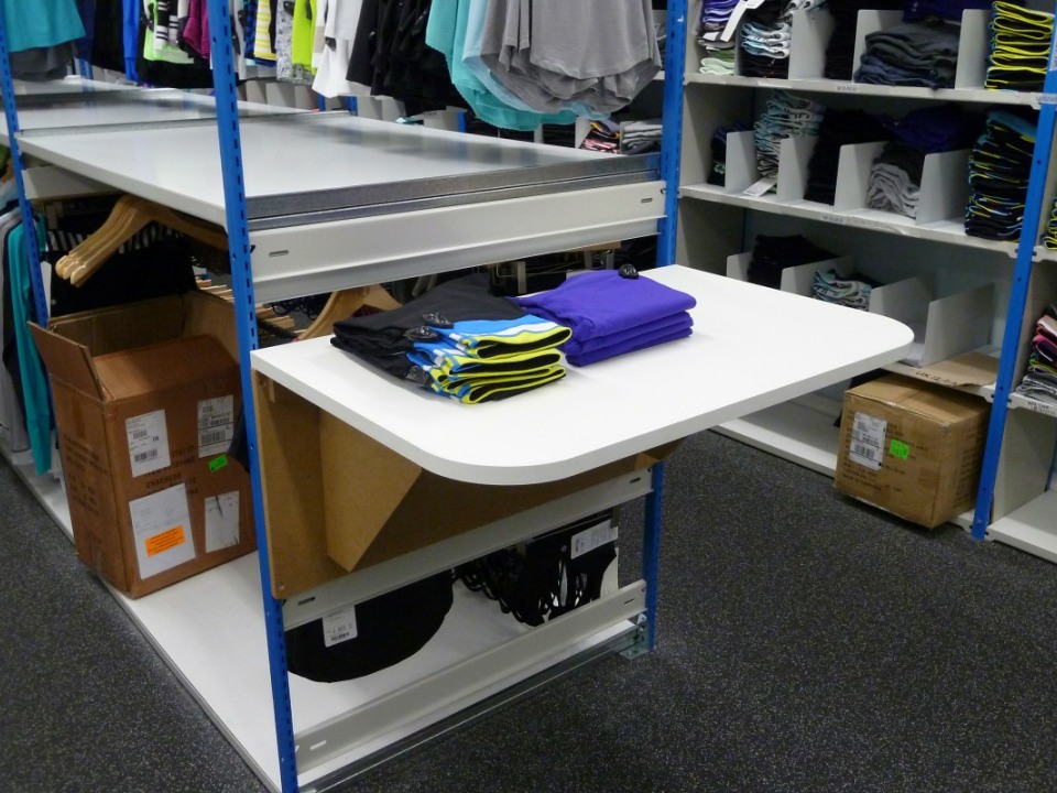 Fold-out preparation table attached to the end of shelving units