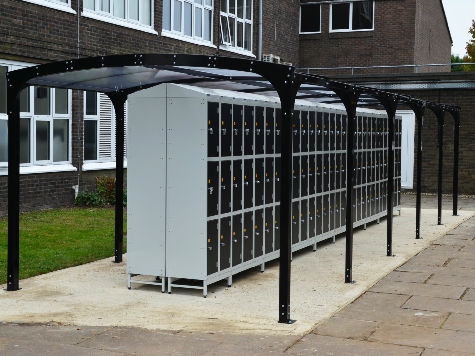 Outdoor school lockers under a canopy for protection