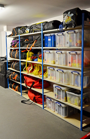 Storage shelving with sports bags and Really Useful Boxes