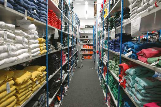 Stockroom shelves full of clothes