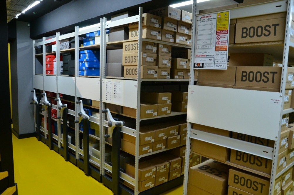 Mobile racking in a retail shoe store