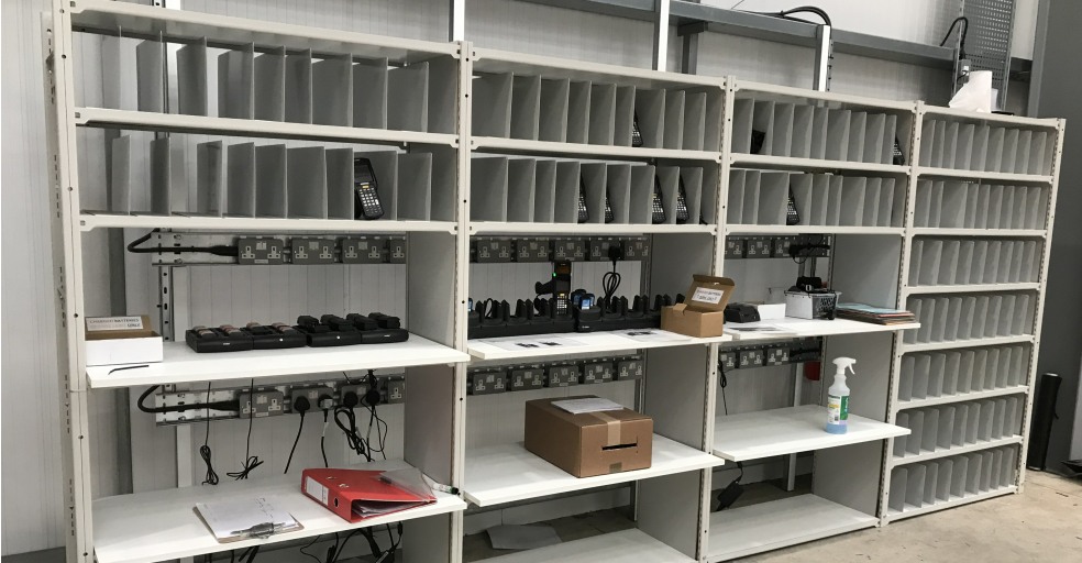 Shelving for handheld barcode scanners