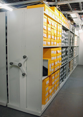 Roller racking storage units holding shoe boxes