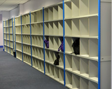 Long runs of pigeon hole shelving