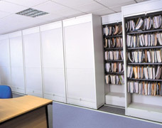 Office storage units that slide from side to side for easy access Side rolling shelving units